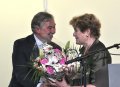 Presents a bouquet to Dame Janet Suzman the Mistress of Ceremonies